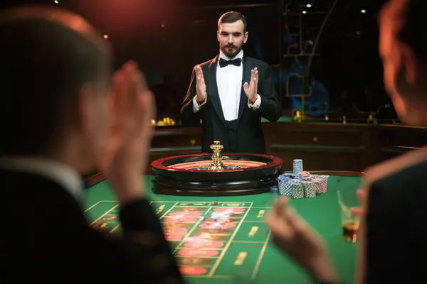 A glamorous woman holding casino chips in a neon-lit environment, representing the premium online casino atmosphere of TIKLUCK.
